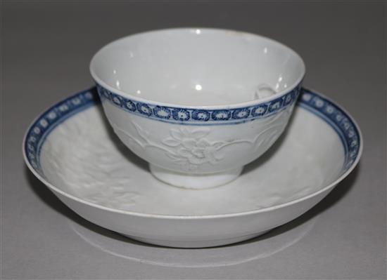 A Liverpool blue and white teabowl and saucer, possibly Philip Christian, moulded in relief with chrysanthemums